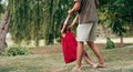 Horizontal image of daughter dancing with father outdoors. Ã¯Â¿Â½ute little girl playing with her loving dad in the park. Daddy and k Royalty Free Stock Photo